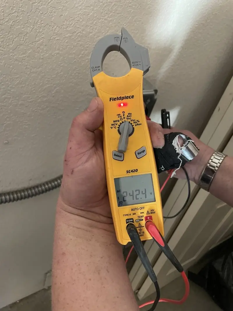 Voltage testing with clamp meter during Electrical Installation Services in Cambridge